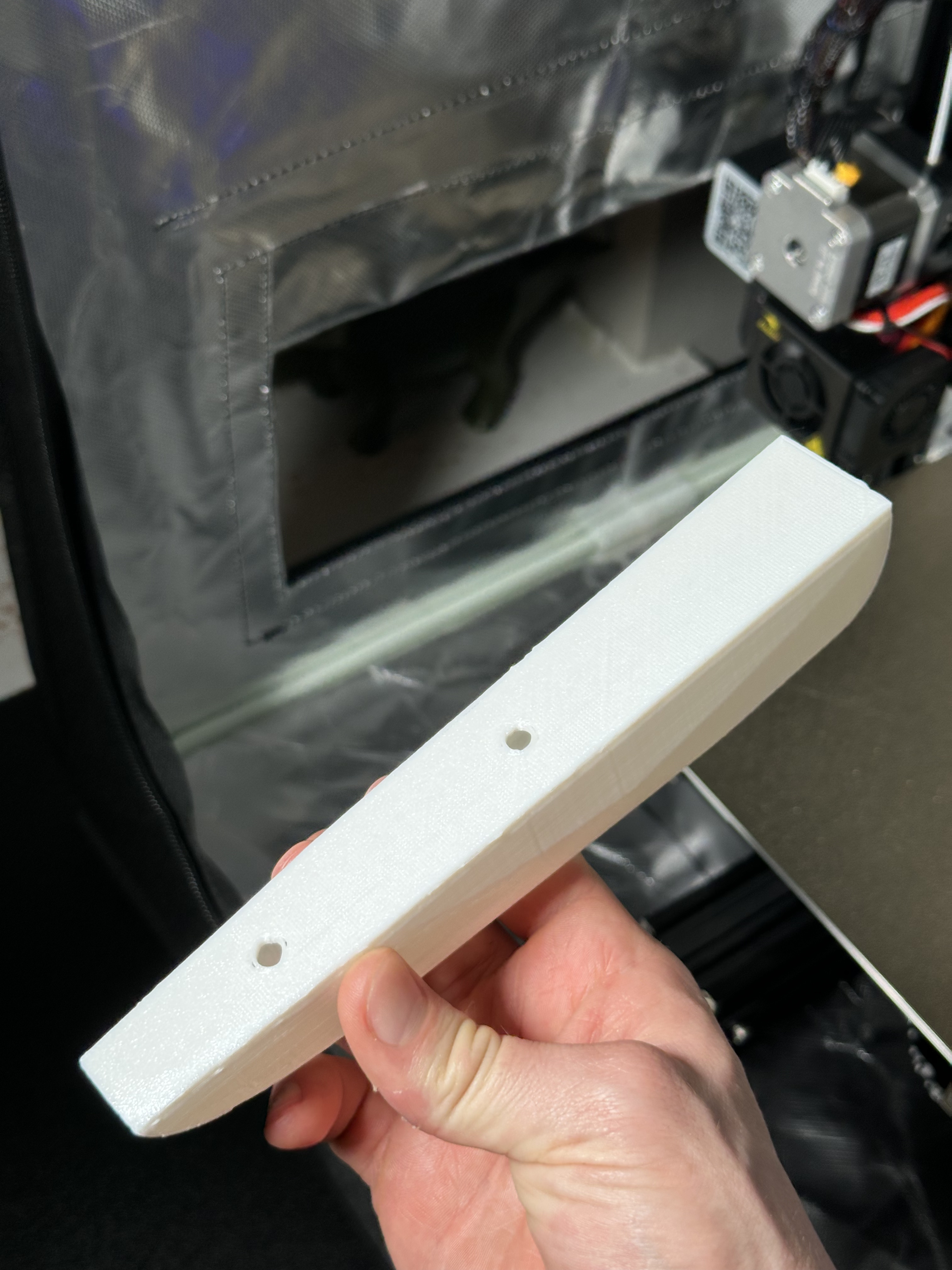 PLA storage box prototype underside with screw holes